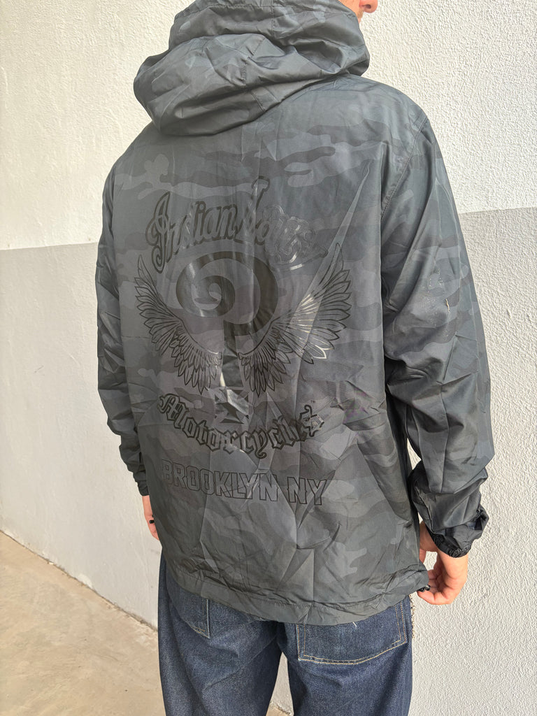 Back of Indian Larry dark camouflage windbreaker with winged graphic and Brooklyn NY lettering